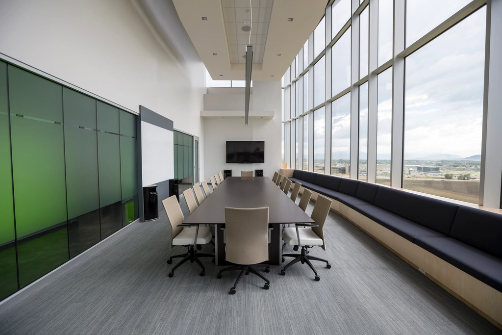 Empty corporate boardroom table with chairs